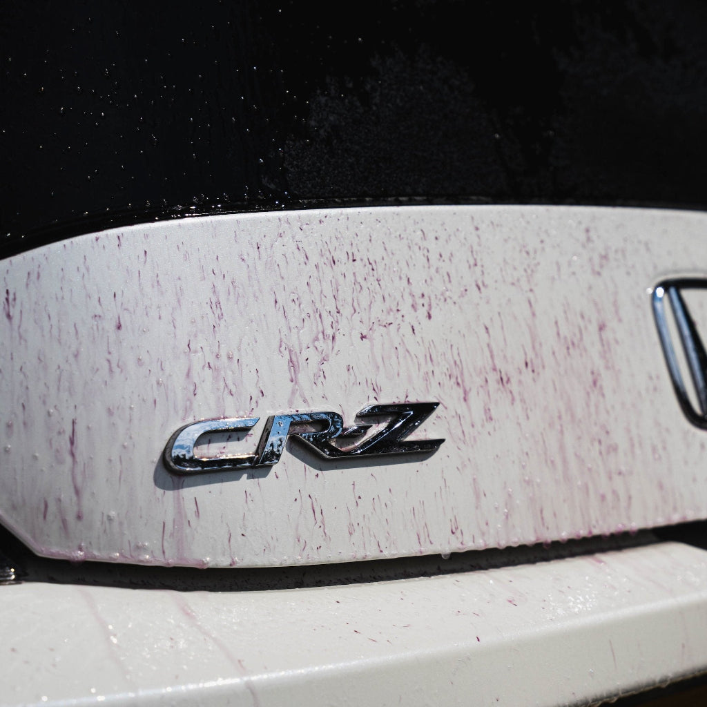 Purple Rain reacting on a boot of a car