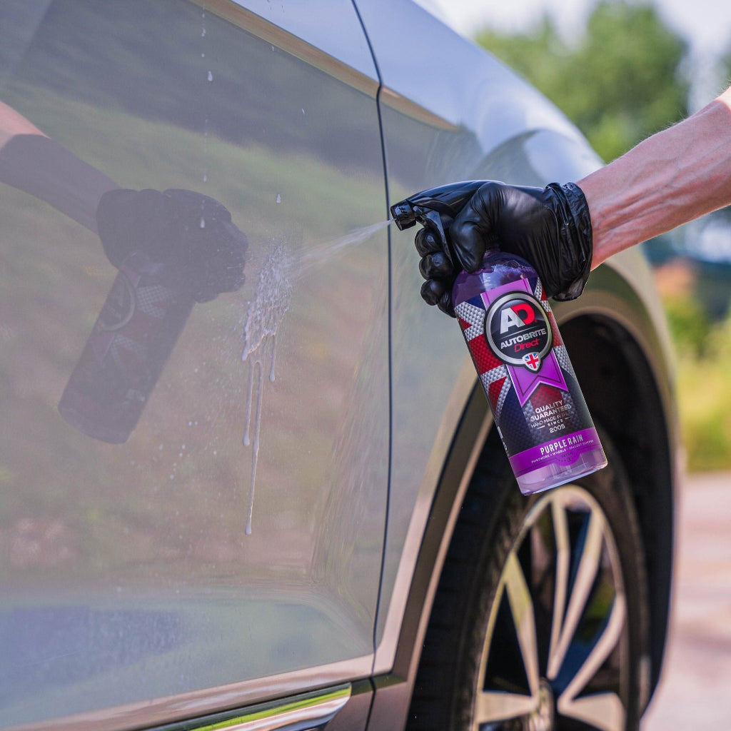 Purple Rain being sprayed on a car